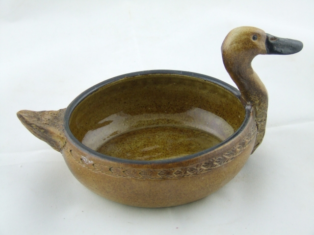 Oval dish with duck
              head and tail