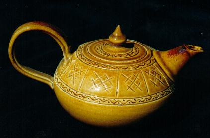 Teapot
                      06, sgraffito pattern and honey glaze