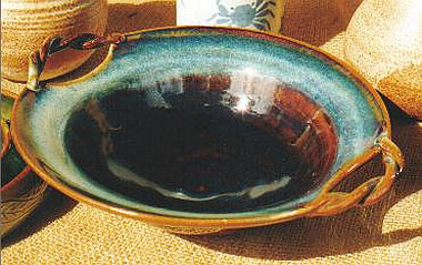Twisty-handle bowl in temmoku glaze